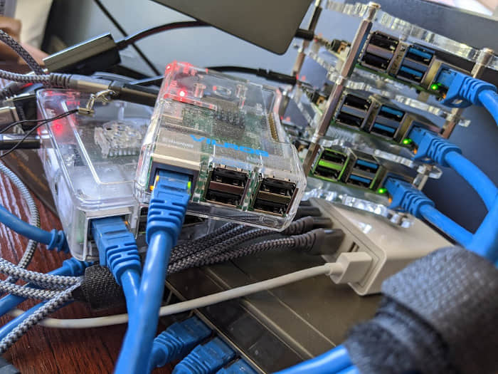 Multiple Raspberry Pi computers, a switch, and a power bank Multiple Raspberry Pi computers, a switch, and a power bank
